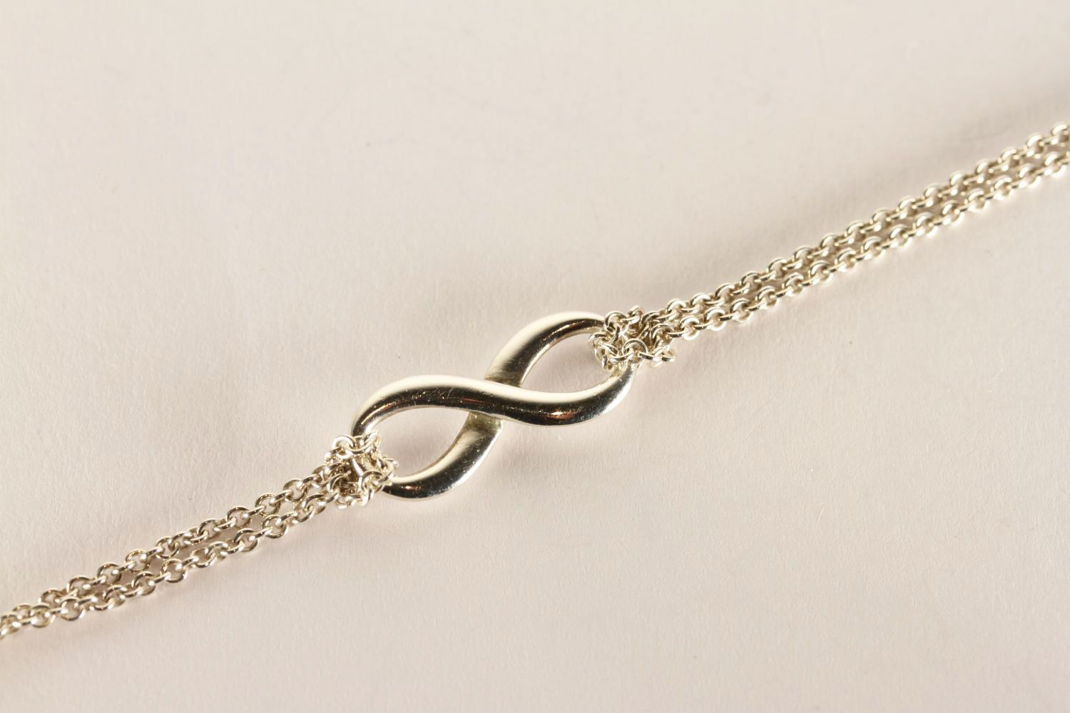 Tiffany & Co Infinity Bracelet, stamped sterling silver, approximate length 14.5cm, comes with a