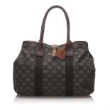 Celine Macadam Tote Bag, this tote bag features a leather body, rolled handles, and an open top,
