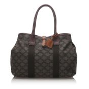 Celine Macadam Tote Bag, this tote bag features a leather body, rolled handles, and an open top,