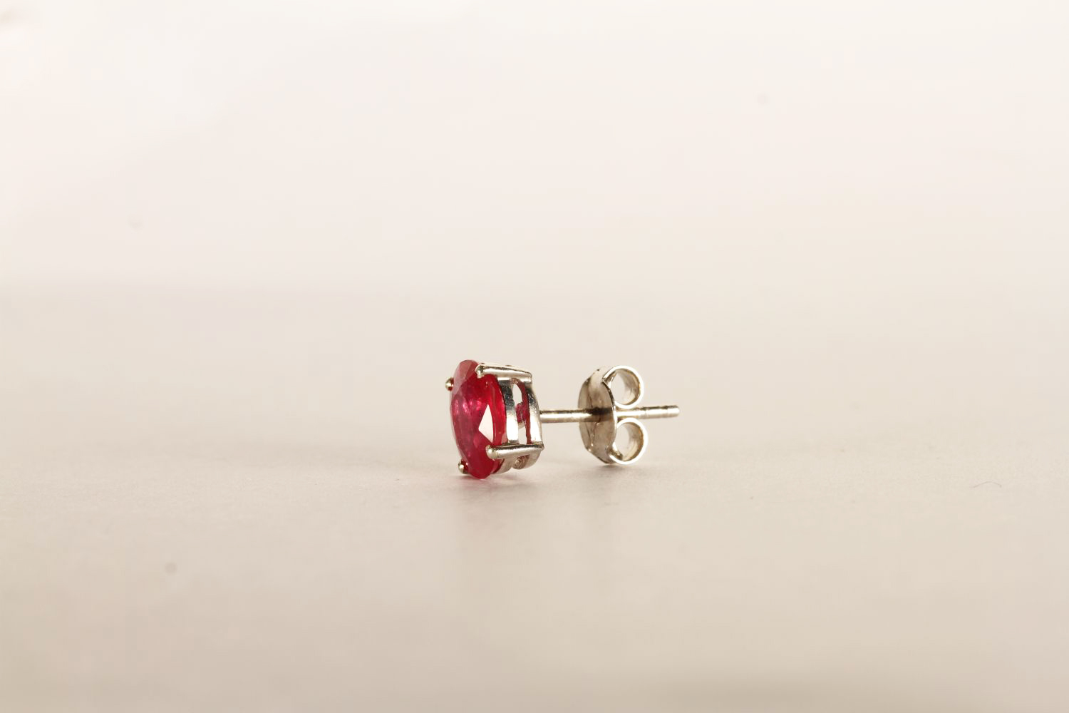 Pair of Ruby Stud Earrings, each set with an oval cut treated ruby, 4 claw set, stamped sterling - Image 2 of 2