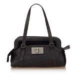Chanel Caviar Leather Reissue Shoulder Bag, this shoulder bag features a caviar leather and velour