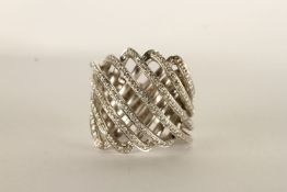 Diamond Swirl Ring, set with round brilliant cut diamonds, stamped 18ct white gold, finger size K