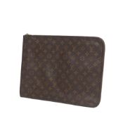 Louis Vuitton Monogram Poche Documents Portfolio, this clutch bag features a monogram canvas body,