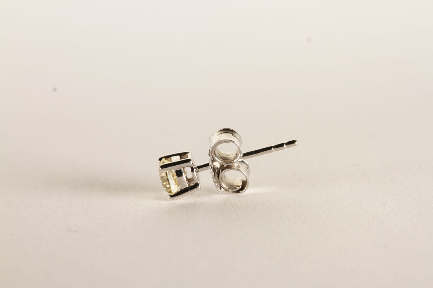 Pair of Diamond Solitaire Stud Earrings, each set with a round brilliant cut diamond, 4 claw set, - Image 2 of 2