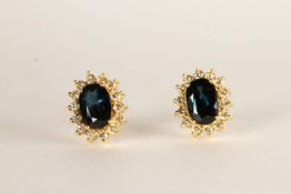 Pair of Sapphire and Diamond Earrings, each set with an oval cut sapphire, claw set, total