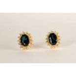 Pair of Sapphire and Diamond Earrings, each set with an oval cut sapphire, claw set, total