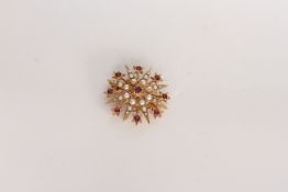 Ruby and pearl set star brooch, ruby set centre, pearl set spray, stamped and tested as 9ct, 5.8g