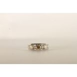 Diamond Ring, centre set with a round brilliant cut diamond, 4 claw set, shoulders set with baguette