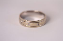 18ct wedding band, set with three diamonds, 5.6g gross