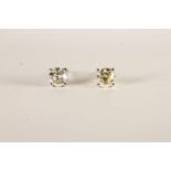 Pair of Diamond Solitaire Stud Earrings, each set with a round brilliant cut diamond, 4 claw set,