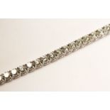 Diamond Tennis Bracelet, set with round brilliant cut diamonds totalling approximately 15.10ct, 4