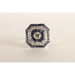 Sapphire and Diamond Ring, square shaped with chamfered corners, centre set with a round brilliant
