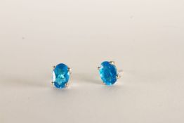 Pair of Neon Blue Apatite Stud Earrings, each set with an oval cut neon blue apatite, 4 claw set,