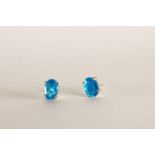 Pair of Neon Blue Apatite Stud Earrings, each set with an oval cut neon blue apatite, 4 claw set,