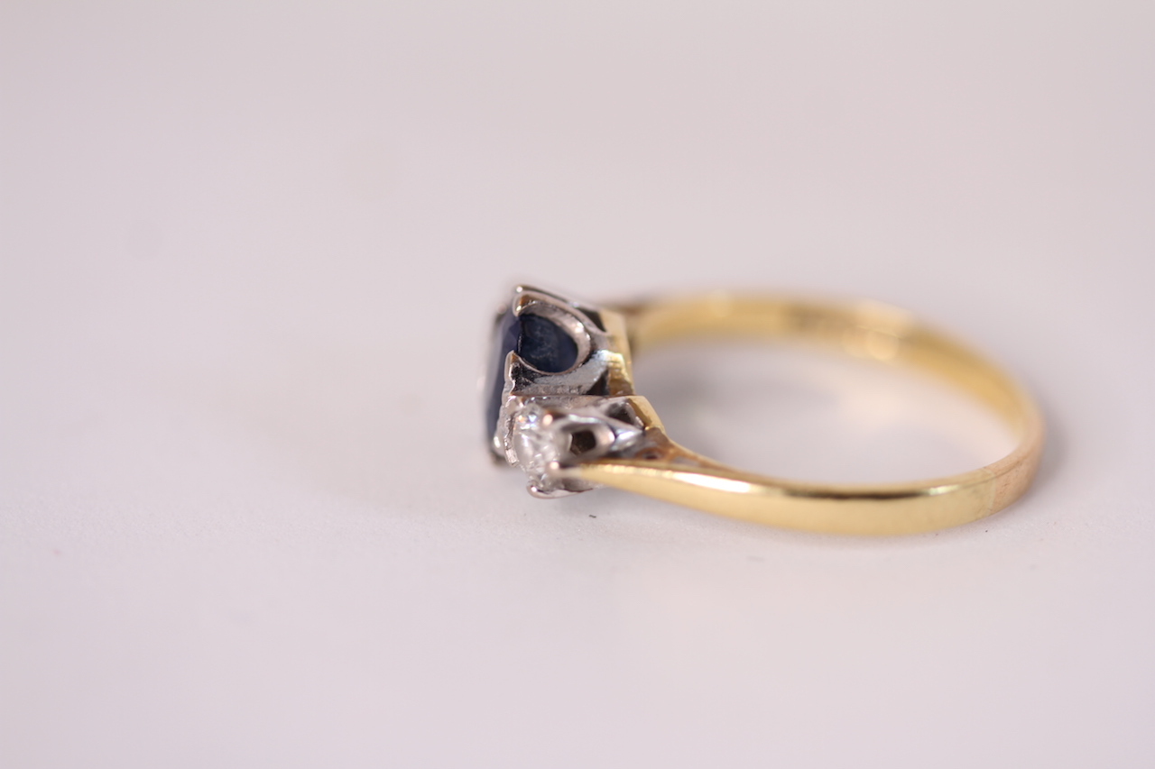 18ct Sapphire and Diamond three stone ring, central oval cut blue sapphire, a brilliant cut - Image 2 of 2