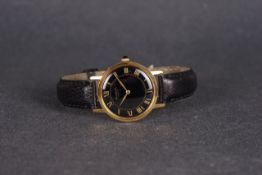 GENTLEMENS RAYMOND WEIL WRISTWATCH, circular black dial with gold roman numeral hour markers and