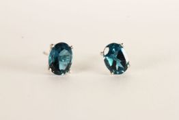 Pair of London Blue Topaz Stud Earrings, each set with an oval cut London blue topaz, 4 claw set,