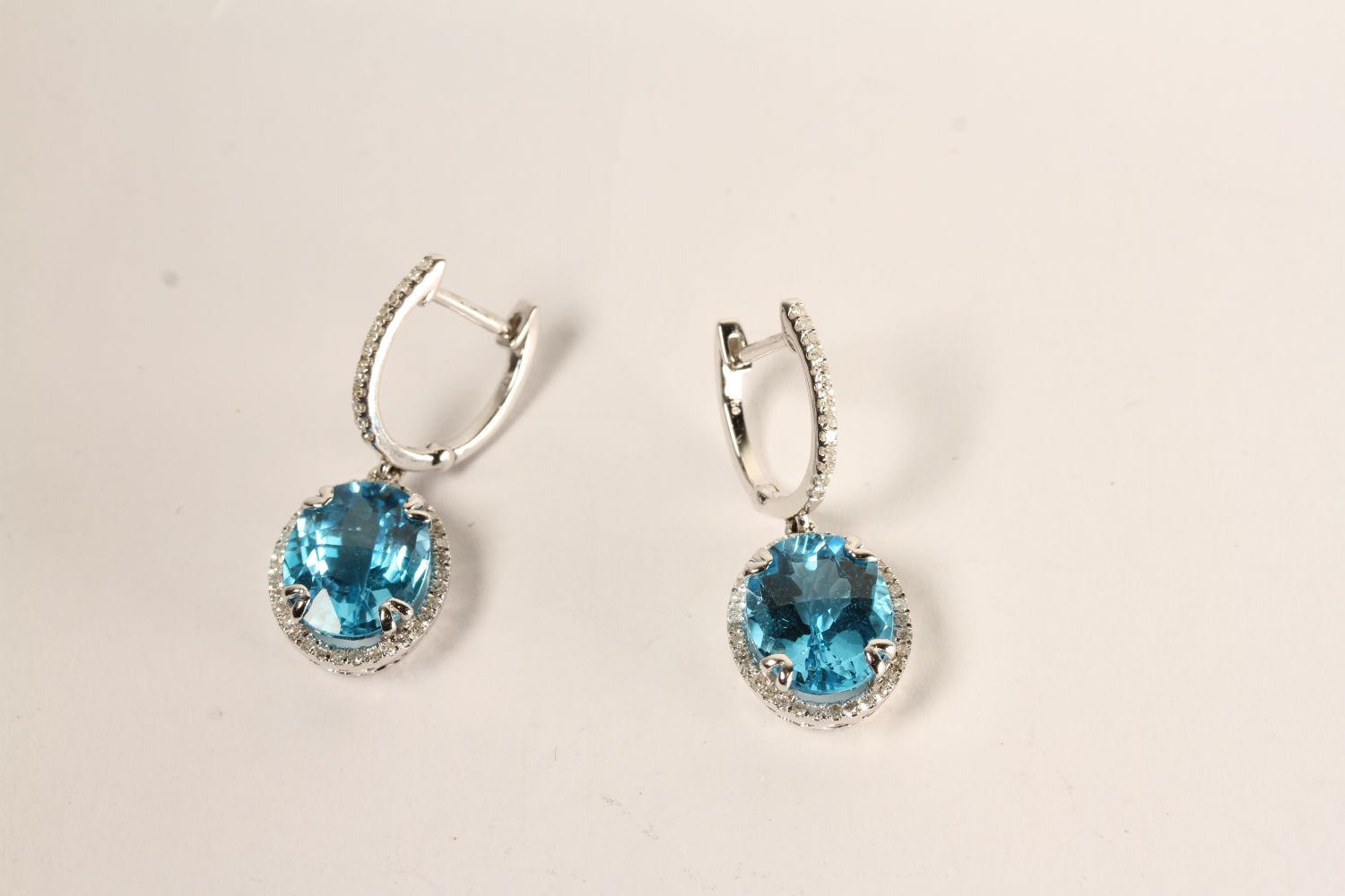 Pair of Blue Topaz and Diamond Drop Earrings, each set with an oval cut blue topaz, claw set, - Image 2 of 3