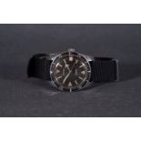 GENTLEMENS CARDINAL DIVER WRISTWATCH, circular black dial with hour markers and a fat arrow hand,