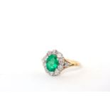 Emerald and Diamond cluster ring, oval cut fine Emerald approximately 8x6mm, brilliant cut diamond