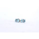 Pair of Blue Topaz Stud Earrings, each set with an oval cut blue topaz,