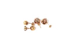 Two pairs of earrings, a tri colour knott set, tested as 9ct, 1.7g and ball studs with screw on