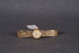 LADIES OMEGA 9CT GOLD LADYMATIC COCKTAIL WATCH, circular patina dial with hour markers and hands,