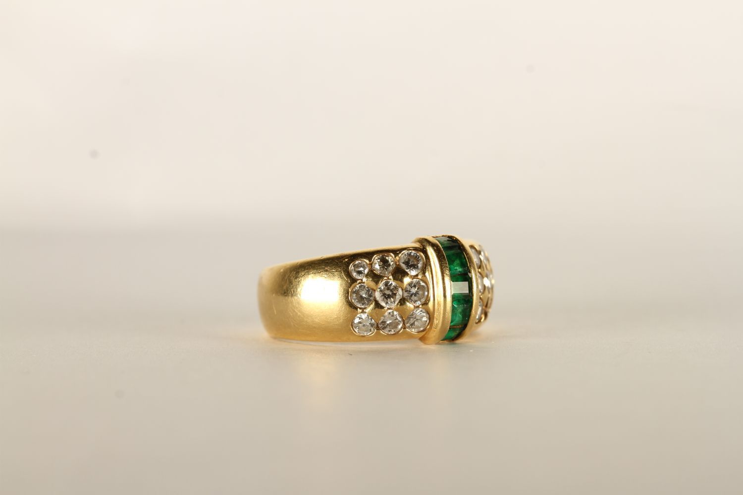 Emerald and Diamond Ring, set with baguette cut emeralds to the centre, surrounded by round - Image 2 of 2