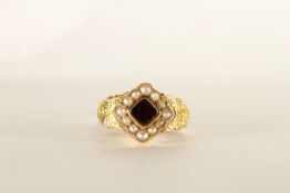 VICTORIAN 18CT GARNET AND SEED PEARL MEMORIAL CLUSTER RING, 'in memory of' band, hallmarked,total