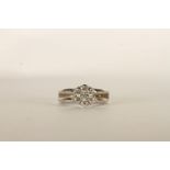 Diamond Flower Ring, set with 7 round brilliant cut diamonds, claw set, finger size F. please note