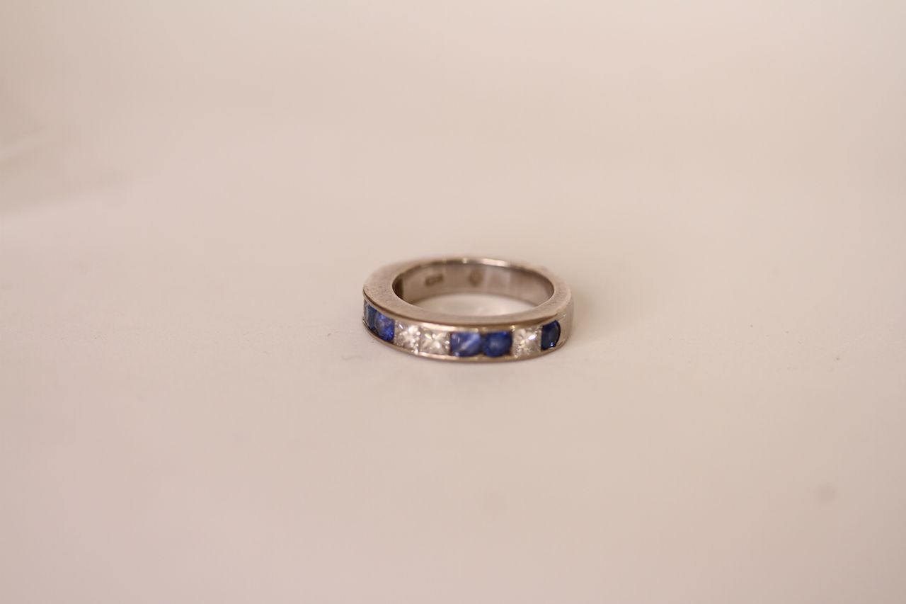 Sapphire and diamond half eternity ring, six round cut blue sapphires, four princess cut diamonds, - Image 2 of 2