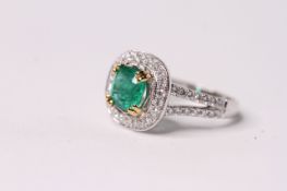 Emerald and Diamond Ring, split diamond-set shoulders, set with emeralds totalling approximately 1.