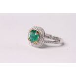 Emerald and Diamond Ring, split diamond-set shoulders, set with emeralds totalling approximately 1.