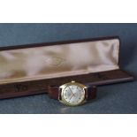 GENTLEMENS TALIS DATE WRISTWATCH W/ BOX, circular silver dial with gold baton hour markers and