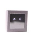 Pair of Tanzanite Stud Earrings, each set with a tanzanite, claw set, sterling silver, comes with