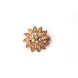 Edwardian Diamond and Pearl set star brooch, 20mm diameter, in yellow gold stamped and tested as