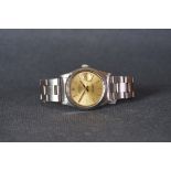 GENTLEMENS ROLEX OYSTER PERPETUAL DATE WRISTWATCH, circular champagne dial with baton hour markers