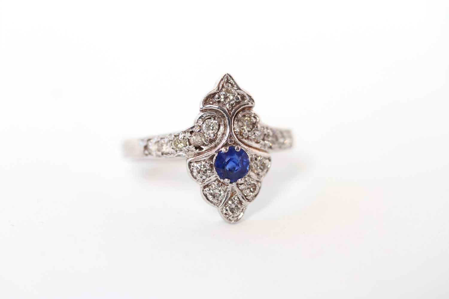 Sapphire and diamond art deco style ring, round cut sapphire set with brilliant cut diamonds,