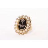 Victorian Mourning Ring, central rose cut diamond flower to Onyx base, border of seed pearls,