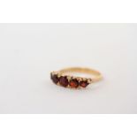 18ct Garnet five stone carved half hoop ring, graduated garnet stones, mounted in hallmarked 18ct,