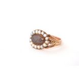Victorian Mourning Ring, central oval exhibition glass with hair display, set with a border of