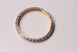 18ct yellow gold diamond set bezel, estimated total diamond weight 0.36ct, measures 32mm outside