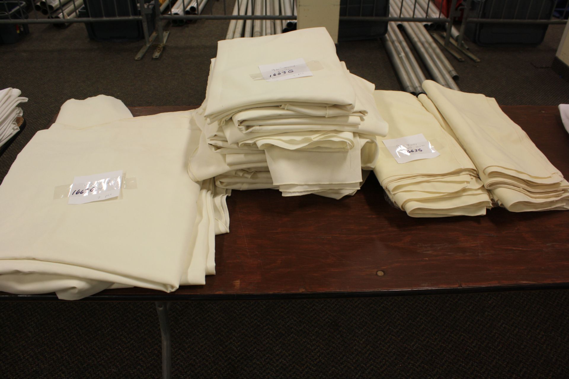 Lot of Ivory Linens including: (3) 90" x 152", (11) 96" Round, and (95) 20" x 20" Napkins