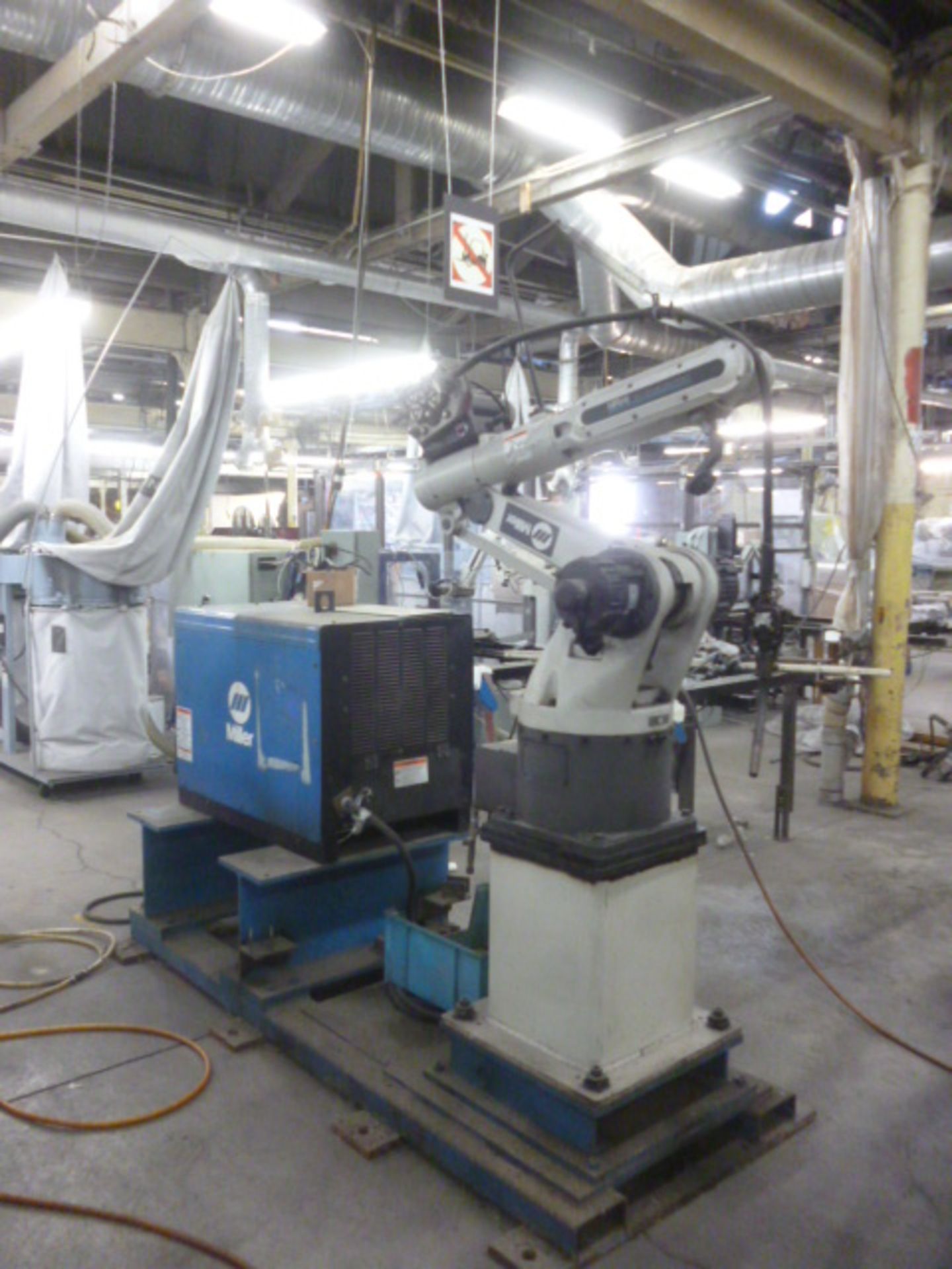 Miller 6-axis robot inoculating a Delta weld CV.DC power welding source.