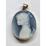 Gold mounted hard stone cameo pendant carved hard-stone figure of a young girl set in hallmarked 9ct