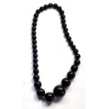 Fine dark Cherry amber / bakelite round bead necklace good internal streaking largest bead meaures a
