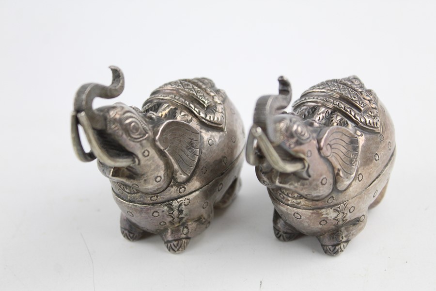 Pair of stamped 900 silver elephant shaped trinket boxes (109g)