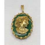 Vintage gold mounted jade and diamond set cameo pendant hallmarked 9.375 head set with small diamond