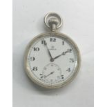 Omega pocket watch winds and ticks nickel case looks in good condition but no warranty given case me