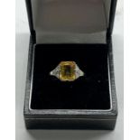 Fine platinum yellow sapphire and diamond ring central stone measures approx 10mm by 7mm set with 3